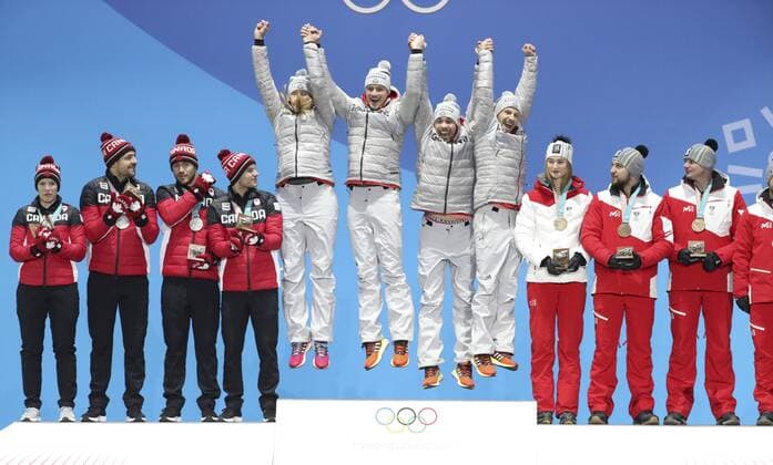 (180216) -- PYEONGCHANG, Feb. 16, 2018 -- Members of champion team Germany (C), second-placed Canada (L) and third-placed Austria react during medal ceremony of team relay competition of luge at 2018 PyeongChang Winter Olympic Games Olympische Spiele Olympia OS at Medal Plaza, PyeongChang, South Korea, Feb. 16. 2018. ) (SP)OLY-SOUTH KOREA-PYEONGCHANG-LUGE-TEAM RELAY-MEDAL CEREMONY BaixXuefei 