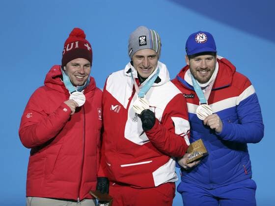 (180216) -- PYEONGCHANG, Feb. 16, 2018 -- Gold medalist Matthias Mayer of Austria (C), Silver medalist Beat Feuz of Switzerland (L) and bronze medalist Kjetil Jansrud of Norway pose for photos during medal ceremony of men s super giant slalom of Alpine Skiing at the 2018 PyeongChang Winter Olympic Games Olympische Spiele Olympia OS at Medal Plaza, PyeongChang, South Korea, on Feb. 16, 2018. ) (SP)OLY-SOUTH KOREA-PYEONGCHANG-MEN S SUPER-G-MEDAL CEREMONY BaixXuefei 