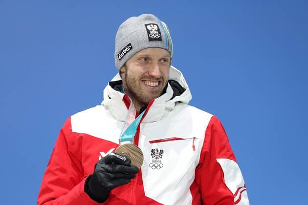 OLYMPICS - 2018 Winter Olympics PYEONGCHANG,SOUTH KOREA,16.FEB.18 - OLYMPICS,BIATHLON - Olympic Winter games Winterspiele Spiele Summer games PyeongChang 2018, Medals Plaza, 20km biathlon, men, award ceremony. Image shows Dominik Landertinger (AUT). GEPAxpictures xMathiasxMandl