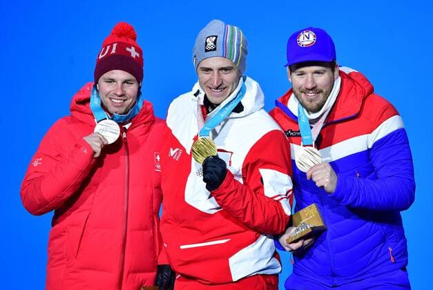 Silver medalist Switzerland s Beat Feuz, gold medalist Austria s Matthias Mayer, and bronze medalist Norway s Kjetill Jansrud pose during the medal ceremony for Men s Alpine Super-G at the Pyeongchang 2018 Winter Olympics in Pyeongchang, South Korea, on February 16, 2018.  OLY20180216346 KEVINxDIETSCH