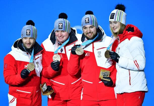 Bronze medalist Austria s Madeleine Egle, David Gleirscher, Peter Penz and Georg Fischler pose during the medal ceremony for Luge Team Relay at the Pyeongchang 2018 Winter Olympics in Pyeongchang, South Korea, on February 16, 2018.  OLY20180216360 KEVINxDIETSCH
