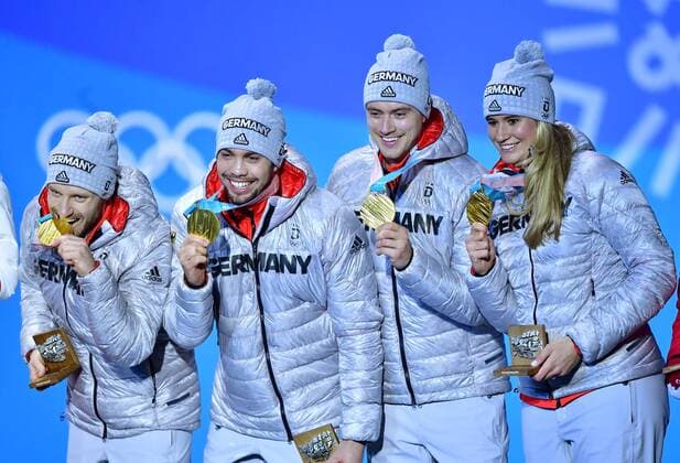 Gold medalist Germany s Natalie Geisenberger, Johannes Ludwig, Tobias Wendl and Tobias Arlt celebrate during the medal ceremony for Luge Team Relay at the Pyeongchang 2018 Winter Olympics in Pyeongchang, South Korea, on February 16, 2018.  OLY20180216362 KEVINxDIETSCH