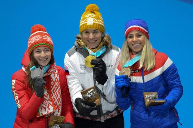 February 18, 2018 - Pyeongchang, South Korea - DARYA DOMRACHEVA of Belarus (left) , ANASTASIYA KUZMINA of Slovakia (center) and TIRIL ECKHOFF of Norway with their medals from the Women s 12.5km Mass Start Biathlon event in the PyeongChang Olympic Games Olympische Spiele Olympia OS Pyeongchang 18: Medal Winners - ZUMAl132 20180218_zap_l132_088 Copyright: xChristopherxLevyx