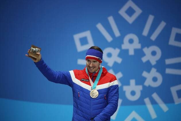 OLYMPICS - 2018 Winter Olympics PYEONGCHANG,SOUTH KOREA,19.FEB.18 - OLYMPICS, BIATHLON - Olympic Winter games Winterspiele Spiele Summer games PyeongChang 2018, Medals Plaza, 15km Mass Start, men, award ceremony. Image shows Emil Hegle Svendsen (NOR). Keywords: medal. GEPAxpictures xAndreasxPranter
