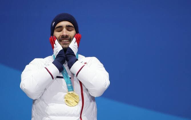 OLYMPICS - 2018 Winter Olympics PYEONGCHANG,SOUTH KOREA,19.FEB.18 - OLYMPICS, BIATHLON - Olympic Winter games Winterspiele Spiele Summer games PyeongChang 2018, Medals Plaza, 15km Mass Start, men, award ceremony. Image shows Martin Fourcade (FRA). Keywords: medal. GEPAxpictures xAndreasxPranter