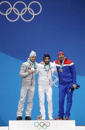 OLYMPICS - 2018 Winter Olympics PYEONGCHANG,SOUTH KOREA,19.FEB.18 - OLYMPICS, BIATHLON - Olympic Winter games Winterspiele Spiele Summer games PyeongChang 2018, Medals Plaza, 15km Mass Start, men, award ceremony. Image shows Simon Schempp (GER), Martin Fourcade (FRA) and Emil Hegle Svendsen (NOR). Keywords: medal. GEPAxpictures xAndreasxPranter