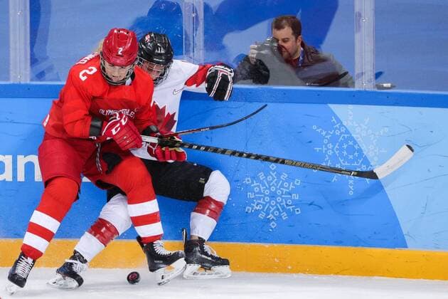 GANGNEUNG, SOUTH KOREA - FEBRUARY 19, 2018: Olympic Athlete from Russia Angelina Goncharenko and Canadaâ€™s Jillian Saulnier (L-R) in a women s semifinal Ice hockey Eishockey match as part of the 2018 Winter Olympic Games Olympische Spiele Olympia OS at the Gangneung Hockey Centre. Sergei Bobylev TASS  TS074AE9