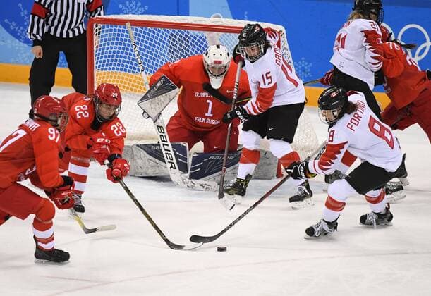 (180219) -- PYEONGCHANG, Feb. 19, 2018 -- Canada s Melodie Daoust (No. 15) and Laura Fortino (No. 8) vie for the puck during the women s semi-final Ice hockey Eishockey match between Canada and the Olympic athletes from Russia at the 2018 PyeongChang Winter Olympic Games Olympische Spiele Olympia OS in Gangneung Hockey Centre, South Korea, on Feb. 19, 2018. Canada won 5-0. ) (SP)OLY-SOUTH KOREA-PYEONGCHANG-ICE HOCKEY-WOMEN-SEMIFINAL WangxSong 