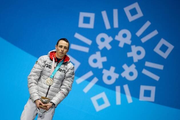 OLYMPICS - 2018 Winter Olympics PYEONGCHANG,SOUTH KOREA,21.FEB.18 - OLYMPICS,NORDIC SKIING, NORDIC COMBINED - Olympic Winter games Winterspiele Spiele Summer games PyeongChang 2018, Medals Plaza, individual large hill, men, award ceremony. Image shows Fabian Riessle (GER). Keywords: medal. GEPAxpictures xMaticxKlansek
