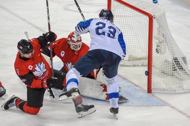 PYEONGCHANG, South Korea - FEBRUARY 21: Canada men s hockey defender Karl Stollery (3) and Finland men s hockey forward Kemppainen Joonas (23) watch a deflected shot on goal sail just wide of the post during the men s hockey semi final game between Canada and Finland during the 2018 Winter Olympic Games Olympische Spiele Olympia OS at the Gangneung Hockey Center on February 21, 2018 in PyeongChang, South Korea. Canada advances to the gold medal game with 1-0 victory. (Photo by Ken Murray Icon Sportswire) OLYMPICS: FEB 21 PyeongChang - Day 14 Icon18022114034 EDITORIAL USE ONLY
