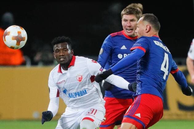 MOSCOW, RUSSIA - FEBRUARY 21, 2018: Crvena Zvezda Belgradeâ€™s El Fardou Ben Nabouhane, CSKA Moscow s Kirill Nababkin and Sergei Ignashevich (L-R) in their 2017-2018 UEFA Europa League Round of 32 second leg football match at VEB Arena in Moscow. Mikhail Metzel TASS  TS075205