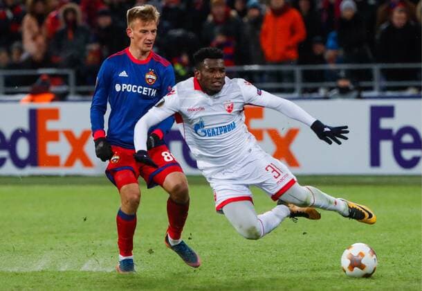 MOSCOW, RUSSIA - FEBRUARY 21, 2018: CSKA Moscow s Konstantin Kuchayev (L) and Crvena Zvezda Belgradeâ€™s El Fardou Ben Nabouhane in their 2017-2018 UEFA Europa League Round of 32 second leg football match at VEB Arena in Moscow; CSKA Moscow won 1-0. Mikhail Metzel TASS  TS075259