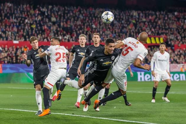 Spain, Sevilla 21.02.2018, UEFA Champions League - 2017 18 Season, Round of 16, First leg, Sevilla FC - Manchester United ManU FC, Chris Smalling (MAN) und Steven N Zonzi (FCS) im Zweikampf ( DeFodi507
