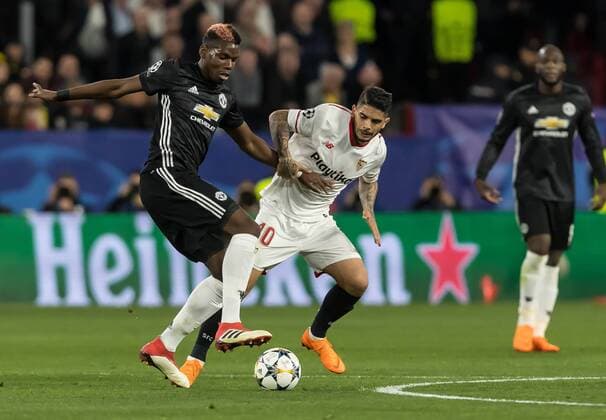 Spain, Sevilla 21.02.2018, UEFA Champions League - 2017 18 Season, Round of 16, First leg, Sevilla FC - Manchester United ManU FC, Paul Pogba (MAN) und Ever Banega (FCS) im Zweikampf ( DeFodi507