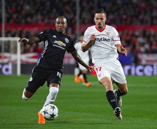 21st February 2018, Ramon Sanchez Pizjuan, Seville, Spain; UEFA Champions League football, round of 16, 1st leg, Sevilla versus Manchester United ManU Ashley Young from Manchester United and Pablo Sarabia from Sevilla FC fight for the ball  ActionPlus11991024