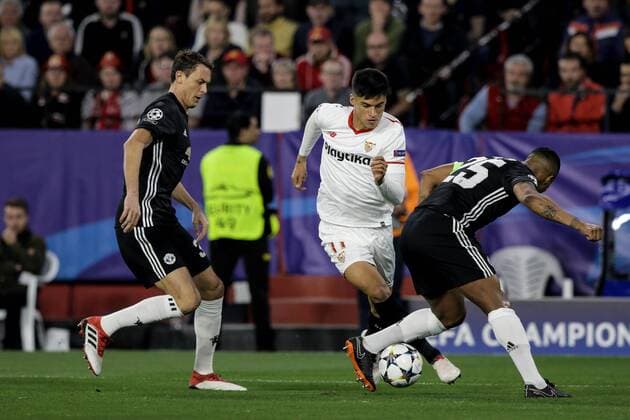 21st February 2018, Ramon Sanchez Pizjuan, Seville, Spain; UEFA Champions League football, round of 16, 1st leg, Sevilla versus Manchester United ManU Correa tries to beat Antonio Valencia and Victor Lindelof  ActionPlus11991224