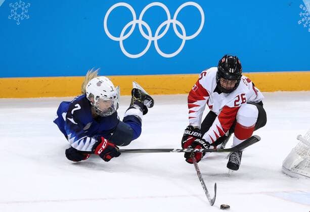 GANGNEUNG, SOUTH KOREA - FEBRUARY 22, 2018: The United Statesâ€™ Monique Lamoureux-Morando (L) and Canadaâ€™s Emily Clark in the women s final Ice hockey Eishockey match as part of the 2018 Winter Olympic Games Olympische Spiele Olympia OS at the Gangneung Hockey Centre. Valery Sharifulin TASS  TS0752B1
