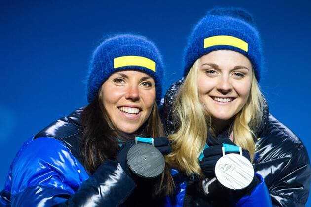180222 Charlotte Kalla and Stina Nilsson of Sweden, Silver, celebrates with the medals at the Medal Ceremony during day thirteen of the 2018 Winter Olympics on February 22, 2018 in Pyeongchang. Photo: Carl Sandin BILDBYRAN kod CS 57999_316 Copyright: CARLxSANDIN BB180222CS031