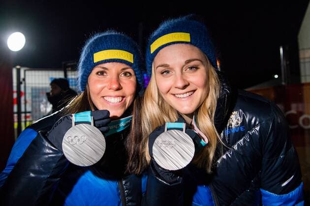 180222 Charlotte Kalla and Stina Nilsson of Sweden, Silver, celebrates with the medals at the Medal Ceremony during day thirteen of the 2018 Winter Olympics on February 22, 2018 in Pyeongchang. Photo: Carl Sandin BILDBYRAN kod CS 57999_316 Copyright: CARLxSANDIN BB180222CS034