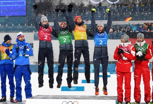 Pyeongchang Olympics German Nordic combined skiers celebrate on the podium after winning the team event at the Pyeongchang Winter Olympics in South Korea on Feb. 22, 2018. 