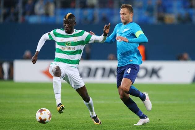 ST PETERSBURG, RUSSIA â€“ FEBRUARY 22, 2018: Celtic s Eboue Kouassi (L) and Zenit St Petersburg s Domenico Criscito figth for the ball in their Leg 2 of the 2017 18 UEFA Europa League Round of 32 football match at Saint Petersburg Stadium. Peter Kovalev TASS  TS075528