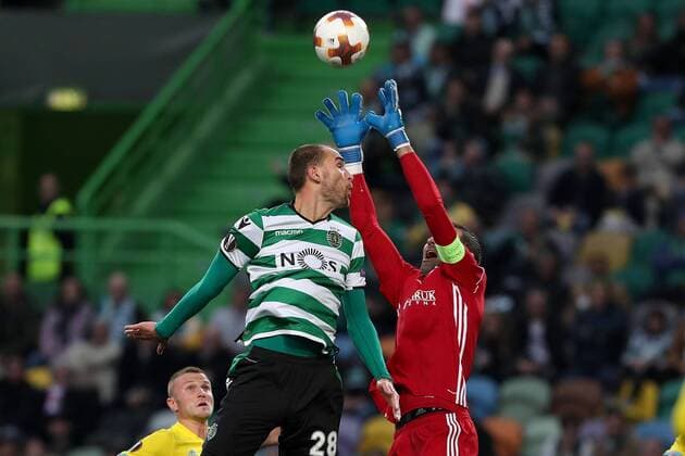 February 22, 2018 - Lisbon, Portugal - Sporting s forward Bas Dost from Holland (L) vies with AstanaÂ«s goalkeeper Nenad Eric during the UEFA Europa League round of 32 second leg football match between Sporting CP and FC Astana at Alvalade stadium in Lisbon, Portugal on February 22, 2018. UEFA Europa League round of 32 second leg football match Sporting CP vs FC Astana - ZUMAf123 20180222_zap_f123_009 Copyright: xPedroxFiuzax