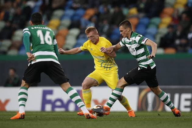 February 22, 2018 - Lisbon, Portugal - Astana s midfielder Laszlo Tleinheisler (C) vies for the ball Sporting s midfielder Joao Palhinha (R) and Sporting s midfielder Rodrigo Battaglia (L) with during UEFA Europa League round of 32 second leg football match between Sporting CP vs FC Astana, in Lisbon, on February 21, 2018. Sporting Lisbon v FC Astana - UEFA Europa League  - ZUMAn230 20180222_zaa_n230_493 Copyright: xCarlosxPalmax