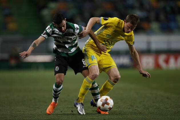 February 22, 2018 - Lisbon, Portugal - Sporting s midfielder Bruno Fernandes (L) vies for the ball with Astana s midfielder Marin Tomasov during UEFA Europa League round of 32 second leg football match between Sporting CP vs FC Astana, in Lisbon, on February 21, 2018. Sporting Lisbon v FC Astana - UEFA Europa League  - ZUMAn230 20180222_zaa_n230_505 Copyright: xCarlosxPalmax