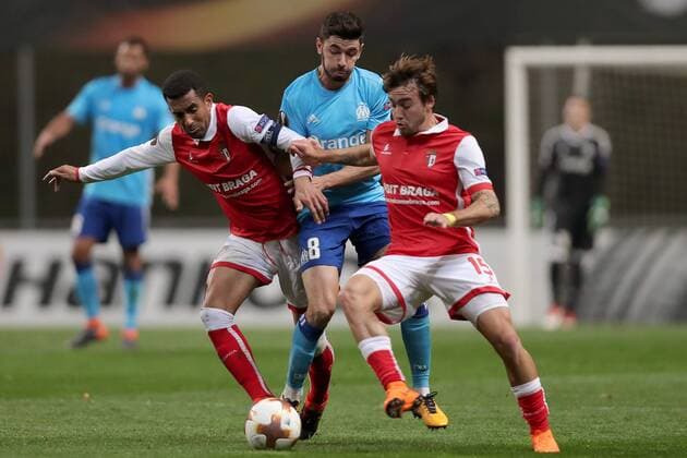 February 22, 2018 - Braga, Braga, Portugal - Braga s Brazilian defender Marcelo Goiano vies for the ball with Marseille s French midfielder Morgan Sanson and Braga s Portuguese midfielder Andre Horta during the UEFA Europa League, match between SC Braga and Olympique Marseille, at Municipal de Braga Stadium in Braga on February 22, 2018, Portugal. Sporting Braga v Marseille - UEFA Europa League  - ZUMAn230 20180222_zaa_n230_1109 Copyright: xDpix