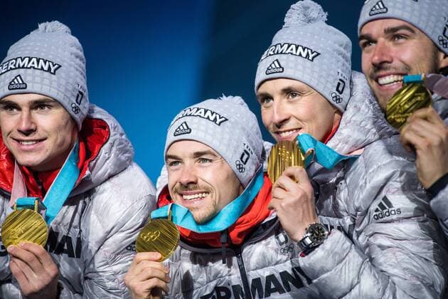 180223 Vinzenz Geiger, Fabian Riessle, Eric Frenzel and Johannes Rydzek of Germany, Gold, celebrates at the Medal Ceremony for Nordic Combined Team Gundersen LH 4x5 km during day fourteen of the 2018 Winter Olympics on February 23, 2018 in Pyeongchang. Photo: Joel Marklund BILDBYRAN kod JM 87647 Copyright: JOELxMARKLUND BB180223JM077