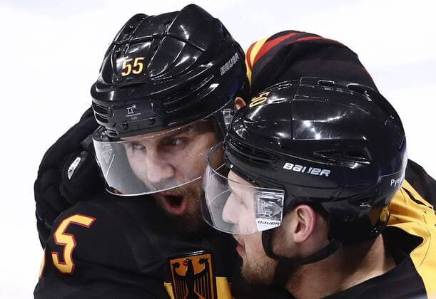GANGNEUNG, SOUTH KOREA â€“ FEBRUARY 23, 2018: Germany s Felix Schutz (L) and Patrick Hager celebrate scoring in their men s semifinal Ice hockey Eishockey match against Canada during the 2018 Winter Olympic Games Olympische Spiele Olympia OS at the Gangneung Hockey Centre. Valery Sharifulin TASS  TS07579D