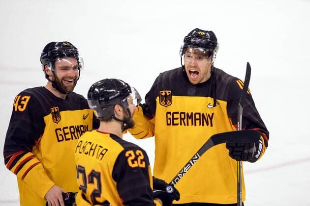 180223 Gerrit Fauser, Matthias Plachta and Björn Krupp of Germany celebrate after the Men s Ice hockey Eishockey semifinal between Canada and Germany during day fourteen of the 2018 Winter Olympics on February 23, 2018 in Pyeongchang. Photo: Petter Arvidson BILDBYRAN kod PA 91999 Copyright: PETTERxARVIDSON BB180223PA142