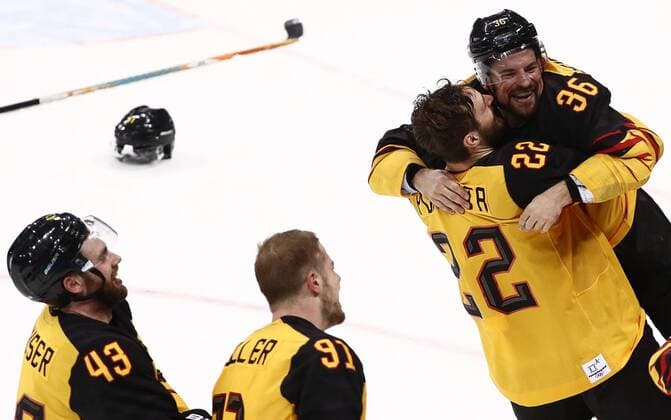 GANGNEUNG, SOUTH KOREA â€“ FEBRUARY 23, 2018: Germany s Gerrit Fauser, Moritz Mueller, Matthias Plachta, and Yannic Seidenberg (L-R) celebrate winning their men s semifinal Ice hockey Eishockey match against Canada during the 2018 Winter Olympic Games Olympische Spiele Olympia OS at the Gangneung Hockey Centre. Team Germany won the game 4-3 and propelled to the final. Valery Sharifulin TASS  TS0757C4