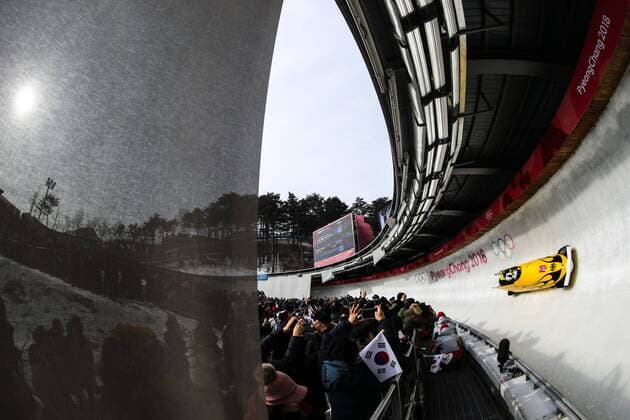 PYEONGCHANG, SOUTH KOREA - FEBRUARY 24, 2018: Germany s Francesco Friedrich, Martin Grothkopp, Candy Bauer, and Thorsten Margis (order not specified) compete in the men s four-man bobsleigh event at the Olympic Sliding Centre in the Alpensia Resort at the 2018 Winter Olympic Games Olympische Spiele Olympia OS Sergei Bobylev TASS  TS075840