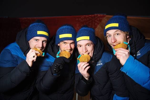 180224 Peppe Femling, Jesper Nelin, Sebastian Samuelsson and Fredrik Lindström of Sweden, Gold, bites theri medals while posing for a picture and celebrating at the Medal Ceremony for the Men s Biathlon 4x7,5 km relay during day fifteen of the 2018 Winter Olympics on February 24, 2018 in Pyeongchang. Photo: Carl Sandin BILDBYRAN kod CS 57999_322 Copyright: CARLxSANDIN BB180224CS124