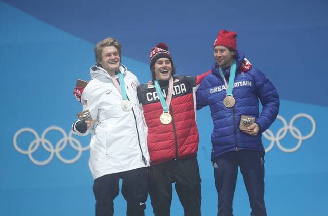 (180224) -- PYEONGCHANG, Feb. 24, 2018 -- Gold medalist Sebastien Toutant of Canada (C), silver medalist Kyle Mack of the United States (L) and bronze medalist Billy Morgan of Britain react during medal ceremony of men s big air of snowboard at the 2018 PyeongChang Winter Olympic Games Olympische Spiele Olympia OS at Medal Plaza, PyeongChang, South Korea, Feb. 24, 2018. ) (SP)OLY-SOUTH KOREA-PYEONGCHANG-SNOWBOARD-MEN S BIG AIR-MEDAL CEREMONY LixGang 