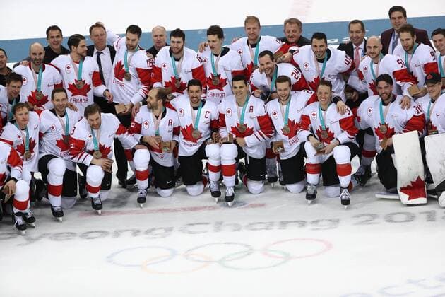 GANGNEUNG, SOUTH KOREA - FEBRUARY 24, 2018: Canada s players pose for a group photo with their medals after winning the men s bronze medal Ice hockey Eishockey game between the Czech Republic and Canada at Gangneug Hockey Centre at the 2018 Winter Olympic Games Olympische Spiele Olympia OS Canada won the game 6-4. Valery Sharifulin TASS  TS075996
