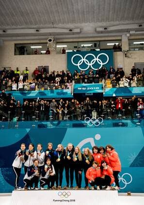 180225 Players of South Korea, Sweden and Japan pose for a picture on the podium after the WomenÕs Curling Final between South Korea and Sweden during day sixteen of the 2018 Winter Olympics on February 25, 2018 in Pyeongchang. Photo: Petter Arvidson BILDBYRN kod PA 160200 Copyright: PETTERxARVIDSON BB180225PA031