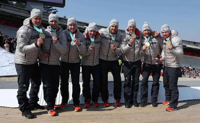 (180225) -- PYEONGCHANG, Feb. 25, 2018 -- Team Germany that won the gold medal and silver medal pose for photos together after the 4-man event of bobsleigh at the 2018 PyeongChang Winter Olympic Games Olympische Spiele Olympia OS at Olympic Sliding Centre, PyeongChang, South Korea, Feb. 25, 2018. The two teams won the gold medal in a time of 3:15.85 and the silver medal in a time of 3:16.38 respectively. ) (SP)OLY-SOUTH KOREA-PYEONGCHANG-BOBSLEIGH-4-MAN BaixXuefei 