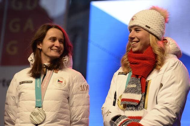 Silver Olympic medallist speed skater Martina Sablikova (left) and double Olympic gold medallist skier and snowboarder Ester Ledecka are seen on the podium during the celebration with fans on the Old Town Square in Prague, Czech Republic, on Monday, February 26, 2018, after the 2018 Winter Olympics in Pyeongchang, South Korea. (CTKxPhoto KaterinaxSulova) CTKPhotoP201802260817701  _SUK9151