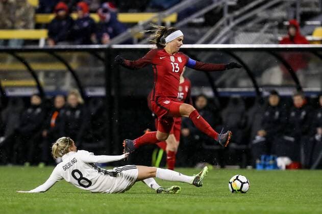 COLUMBUS, OH - MARCH 01: United States forward Alex Morgan (13) jumps over Germany midfielder Lena Goessling (8) and still controls the ball during the second half of the international game between United States and Germany women s national teams on March 01, 2018 at Mapfre Stadium in Columbus, OH. United States won 1-0. (Photo by Adam Lacy Icon Sportswire) SOCCER: MAR 01 SheBelieves Cup - USA v Germany Icon180301018 EDITORIAL USE ONLY