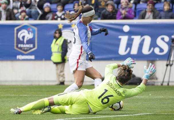 HARRISON, NJ - MARCH 04: Alex Morgan (13) of the USWNT moves the ball around Sara Bouhaddi (16) of France during a She Believes Cup match between the USWNT and France on March 04, 2018, at Red Bull Arena, in Harrison, N.J. The game ended in a 1-1 tie. (Photo by Tony Quinn Icon Sportswire) SOCCER: MAR 04 SheBelieves Cup - USA v France Icon25518030441 EDITORIAL USE ONLY