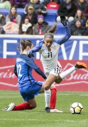 HARRISON, NJ - MARCH 04: Gaetane Thiney (12) of France blocks Mallory Pugh (11) of the USWNT during a She Believes Cup match between the USWNT and France on March 04, 2018, at Red Bull Arena, in Harrison, N.J. The game ended in a 1-1 tie. (Photo by Tony Quinn Icon Sportswire) SOCCER: MAR 04 SheBelieves Cup - USA v France Icon25518030459 EDITORIAL USE ONLY