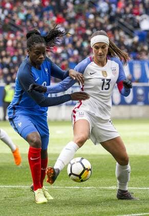 HARRISON, NJ - MARCH 04: Griedge Mbock Bathy (19) of France tackles Alex Morgan (13) of the USWNT during a She Believes Cup match between the USWNT and France on March 04, 2018, at Red Bull Arena, in Harrison, N.J. The game ended in a 1-1 tie. (Photo by Tony Quinn Icon Sportswire) SOCCER: MAR 04 SheBelieves Cup - USA v France Icon25518030471 EDITORIAL USE ONLY