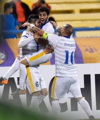 (180306) -- DOHA, March 6, 2018 -- Al Gharafa s defender Rubert Quijada (L) celebrates with teammates after scoring the first goal during the AFC Champions League Group A soccer match between Qatar s Al-Gharafa and Saudi Arabia s Al Ahli at Thani bin Jassim Stadium in Doha, Capital of Qatar, March 5, 2018. The match ended with a 1-1 draw. ) (SP)QATAR-DOHA-SOCCER-AFC-AL GHARAFA VS AL AHLI Nikku 