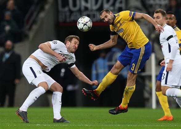 7th March 2018, Wembley Stadium, London England; UEFA Champions League football, round of 16, 2nd leg, Tottenham Hotspur versus Juventus; Harry Kane of Tottenham Hotspur and Giorgio Chiellini of Juventus compete for the ball  ActionPlus11998946