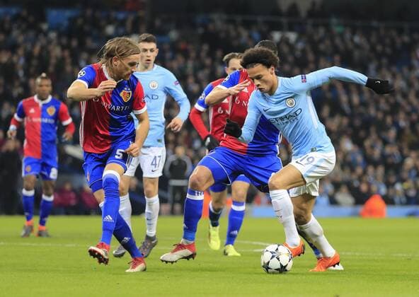 7th March 2018, Etihad Stadium, Manchester, England; UEFA Champions League football, round of 16, 2nd leg, Manchester City versus FC Basel; Leroy Sane of Manchester City is challenged by Michael Lang of Basel  ActionPlus11998979