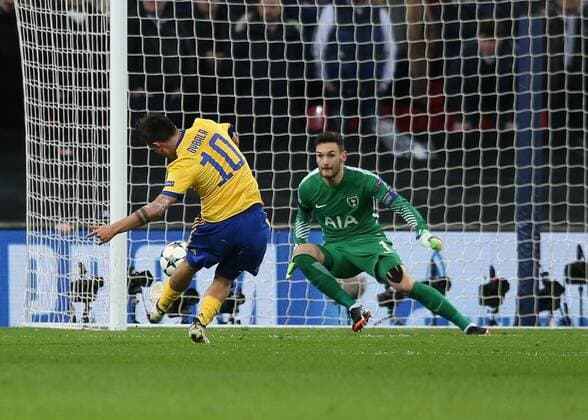 7th March 2018, Wembley Stadium, London England; UEFA Champions League football, round of 16, 2nd leg, Tottenham Hotspur versus Juventus; Paulo Dybala of Juventus scores his sides 2nd goal in the 66th minute to make it 2-1 past Goalkeeper Hugo Lloris of Tottenham Hotspur  ActionPlus11998991