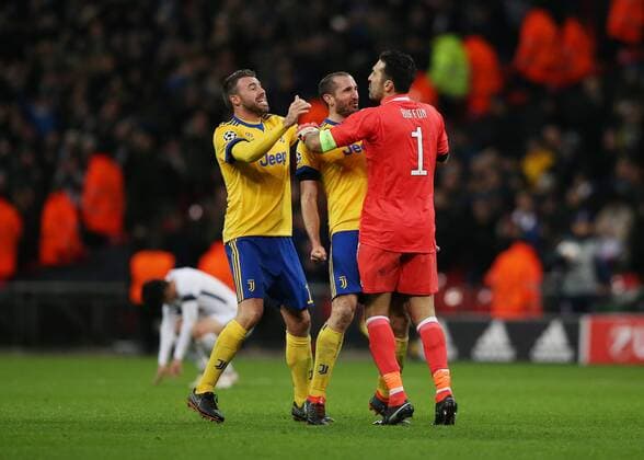 7th March 2018, Wembley Stadium, London England; UEFA Champions League football, round of 16, 2nd leg, Andrea Barzagli of Juventus and Miralem Pjanic of Juventus celebrate with Goalkeeper Gianluigi Buffon of Juventus after the final whistle as Juventus knock out Tottenham Hotspur  ActionPlus11999002