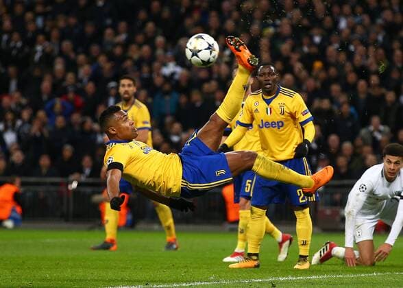 7th March 2018, Wembley Stadium, London England; UEFA Champions League football, round of 16, 2nd leg, Tottenham Hotspur versus Juventus; Douglas Costa of Juventus with an overhead kick to clear the ball out of defense  ActionPlus11999020